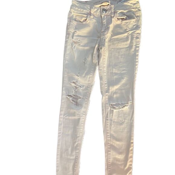 ❣️5/$50 American Eagle Super Stretch Distressed Pink Skinny Jeans size 00 short. - Picture 1 of 3
